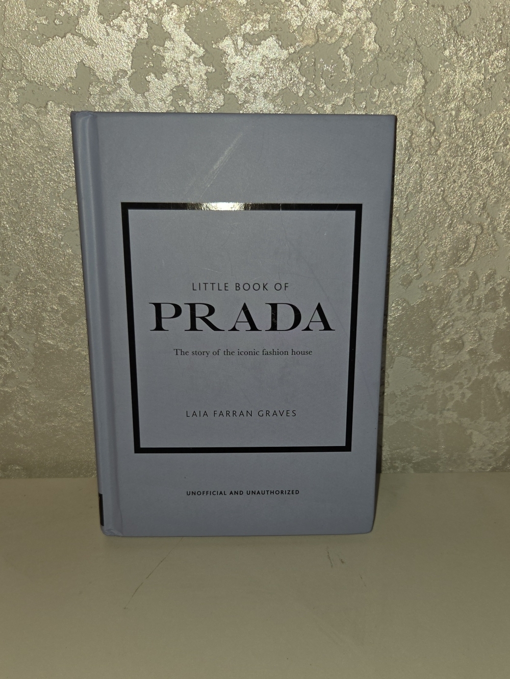 Little Book About Prada. Hardcover Book in Pale Blue with Black Accents